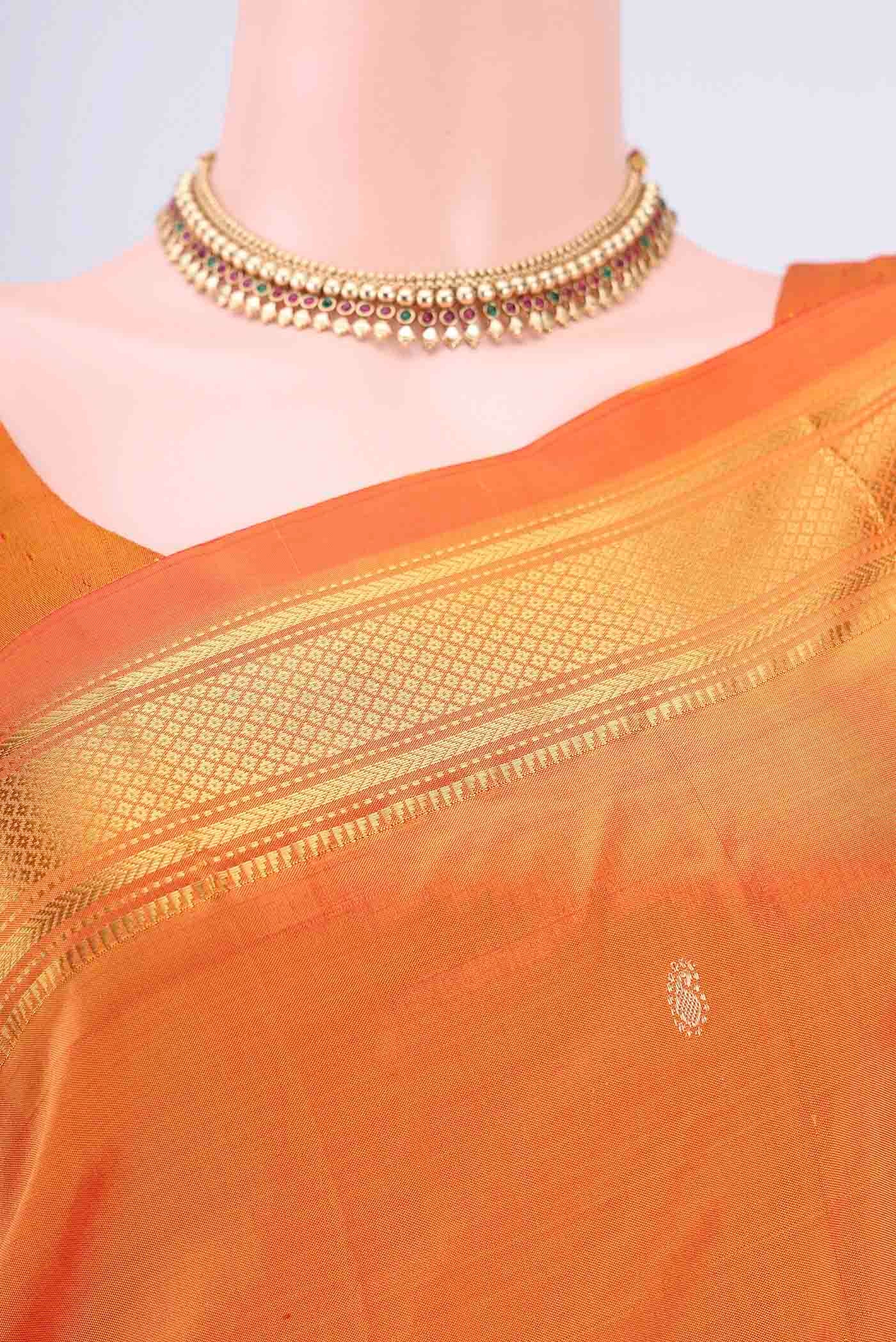 Border image of Brick Orange Paithani Silk Saree with Zari Butta on the body and Zari Border. 