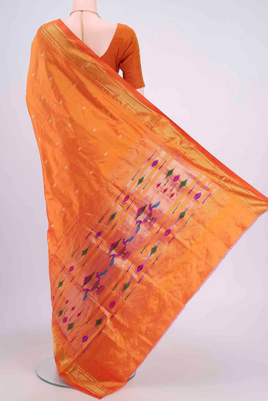 Flat view of Brick Orange Paithani Silk Saree with Zari Butta on the body and Zari Border. 