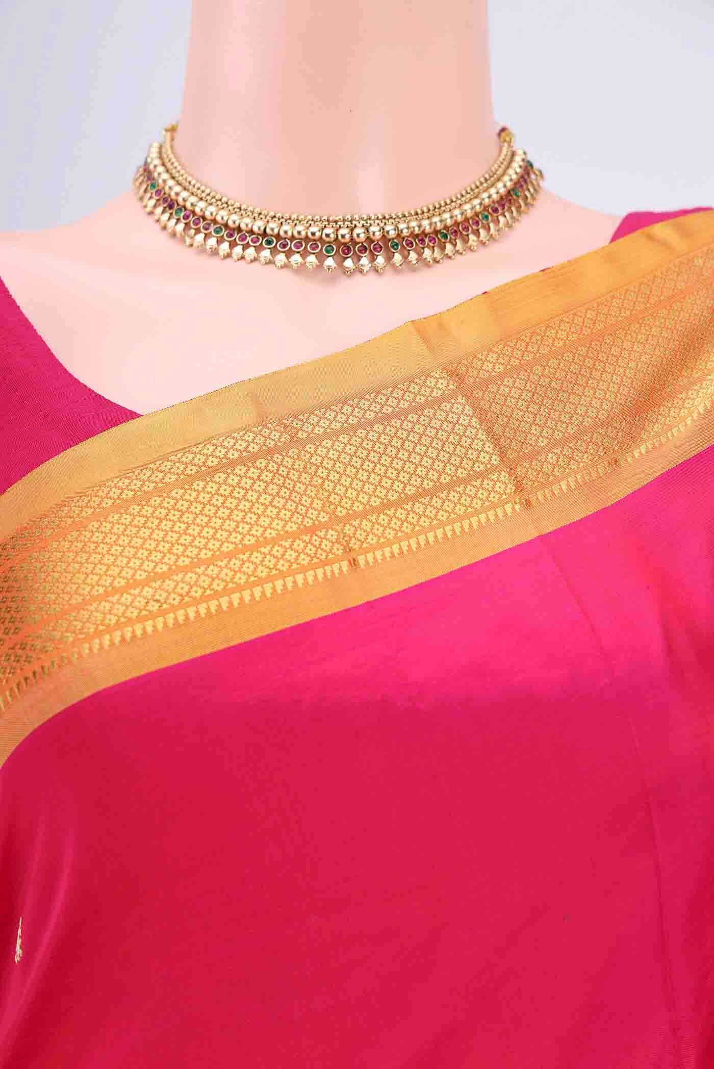 Border image of Dark Pink Paithani Silk Saree with Zari Butta on the body and Zari Border. 