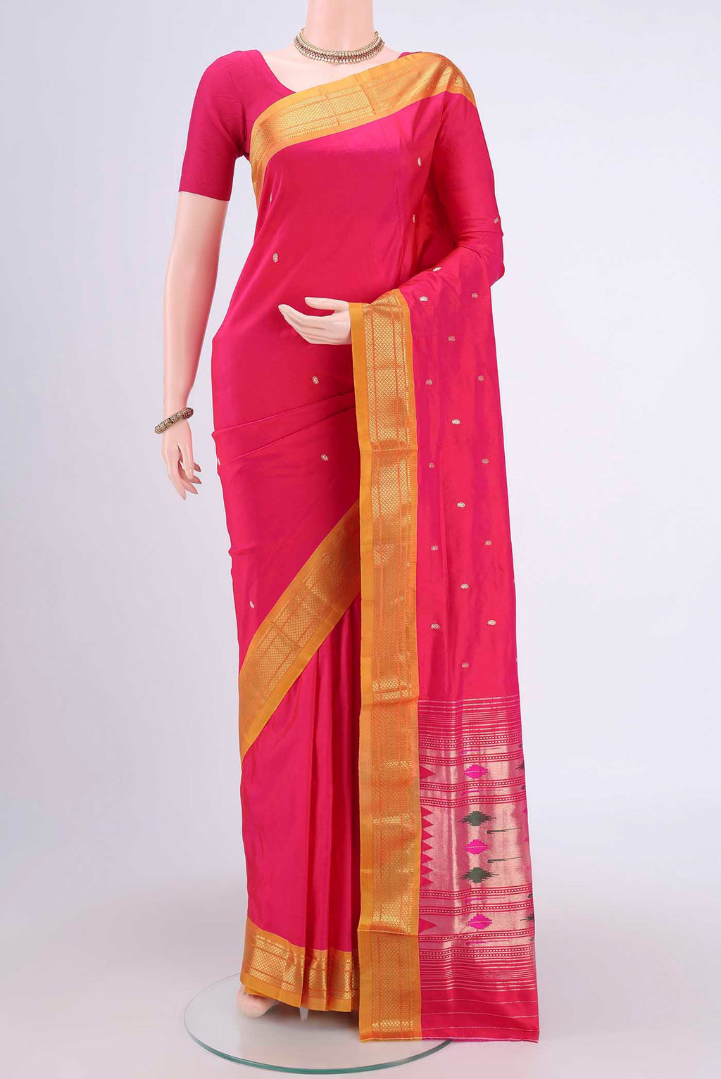 Dark Pink Paithani Silk Saree with Zari Butta on the body and Zari Border.  displayed on a mannequin