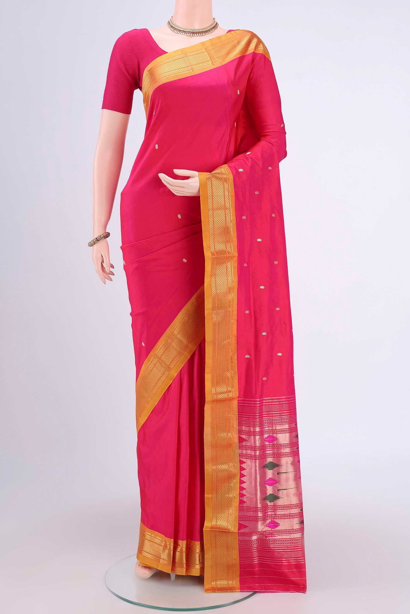 Dark Pink Paithani Silk Saree with Zari Butta on the body and Zari Border.  displayed on a mannequin
