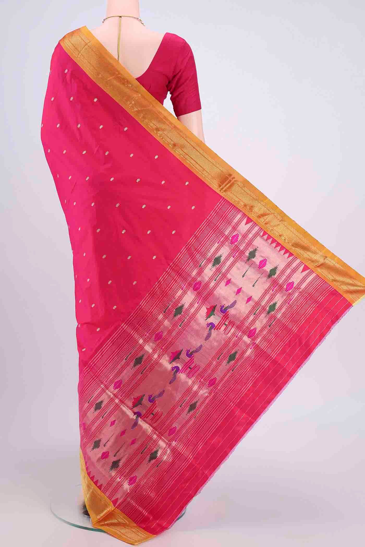 Flat view of Dark Pink Paithani Silk Saree with Zari Butta on the body and Zari Border. 