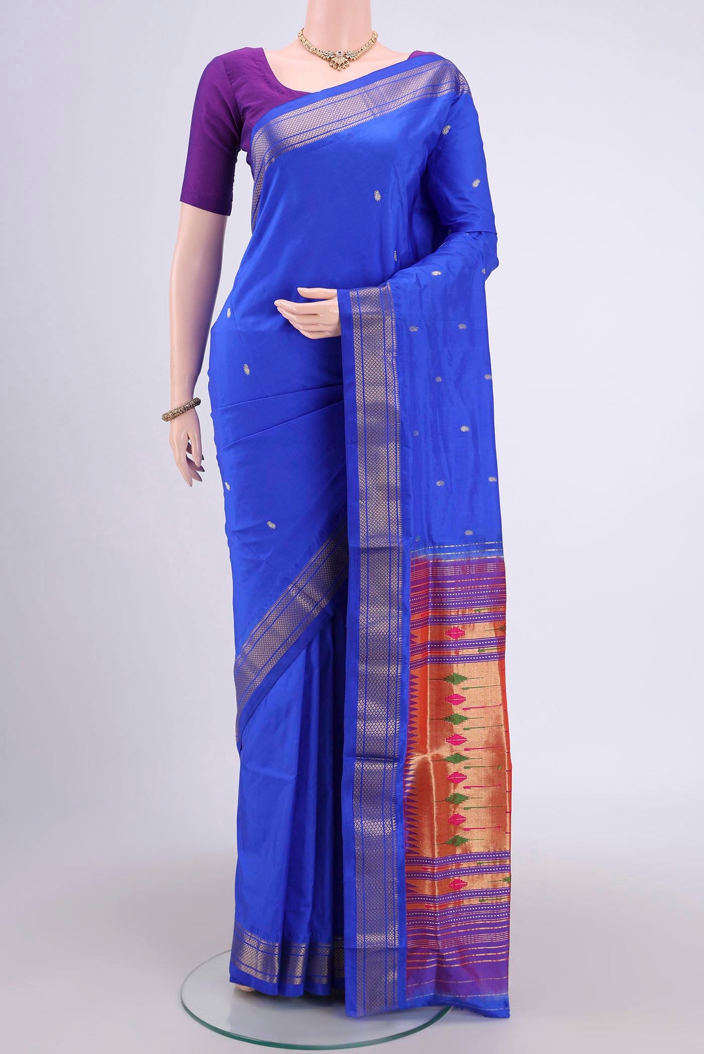 Royal Blue Soft Silk Saree with Zari Butta on the body and Zari Border.  displayed on a mannequin