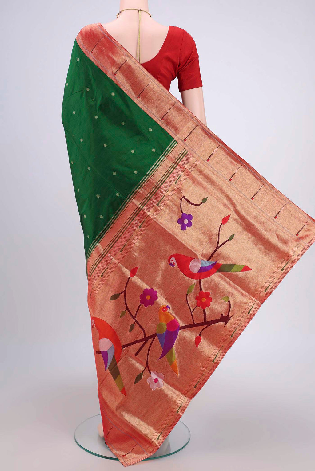 Flat view of Green Soft Silk Saree with Zari Butta on the body and Zari Border. 