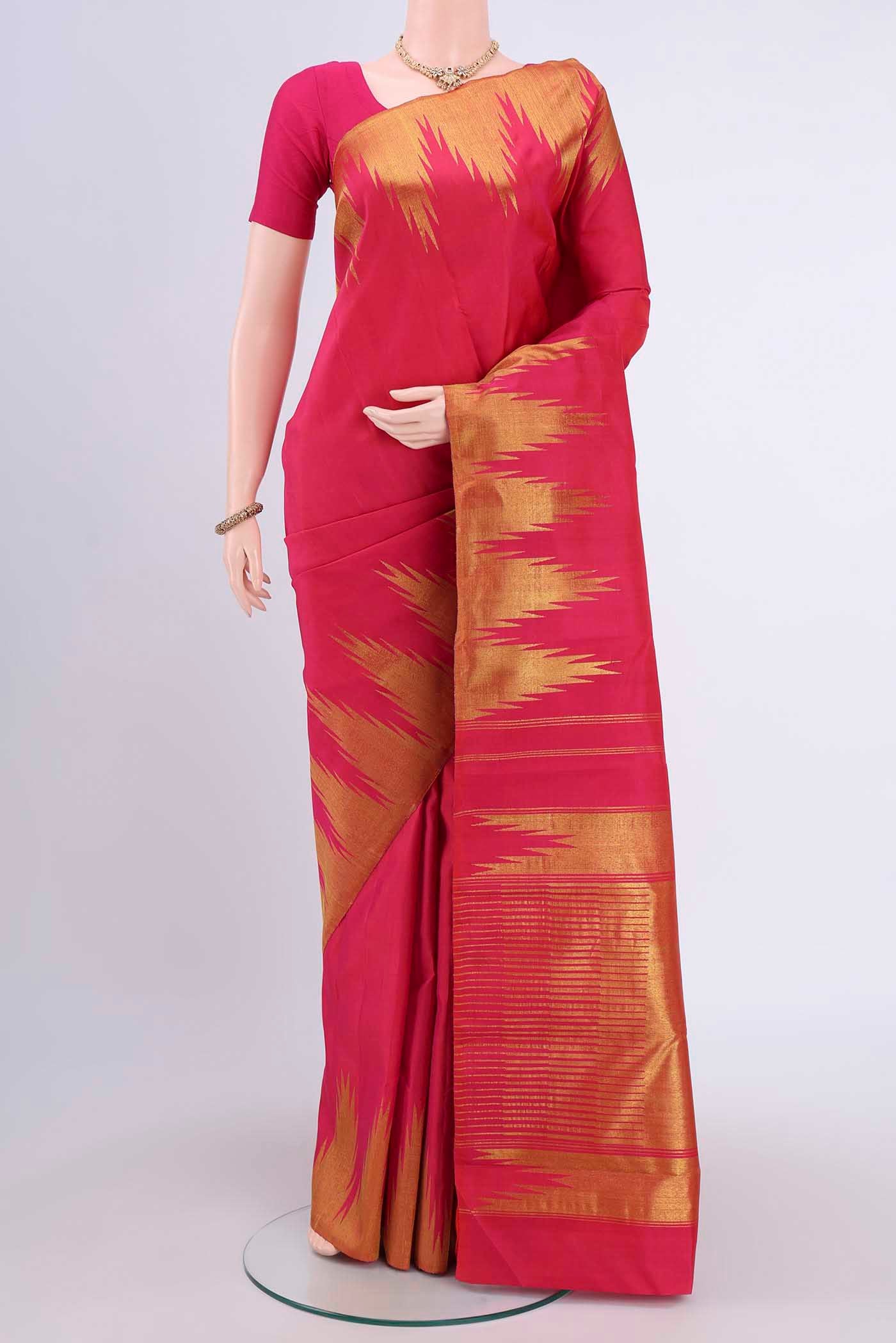 Pure Silk Pure Zari Pink Kanjivaram Saree with Plain Body and Temple Border.  displayed on a mannequin