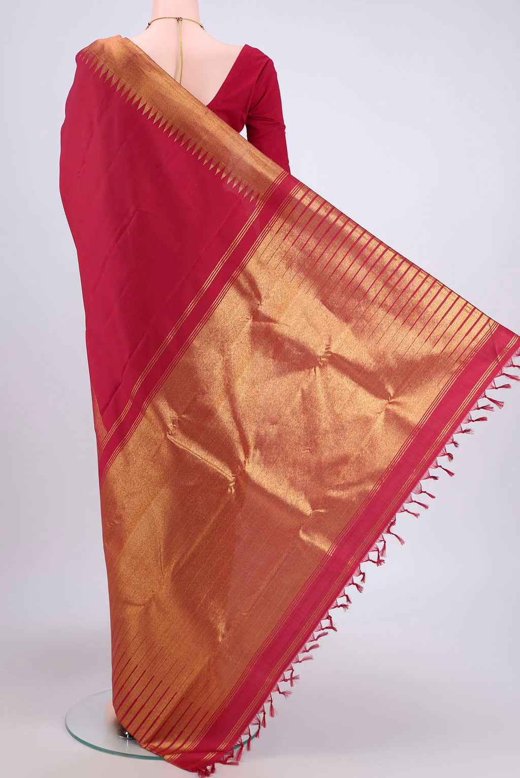 Flat view of Maroon Dual Tone Kanjivaram Saree with Plain Body and Fancy Border. 