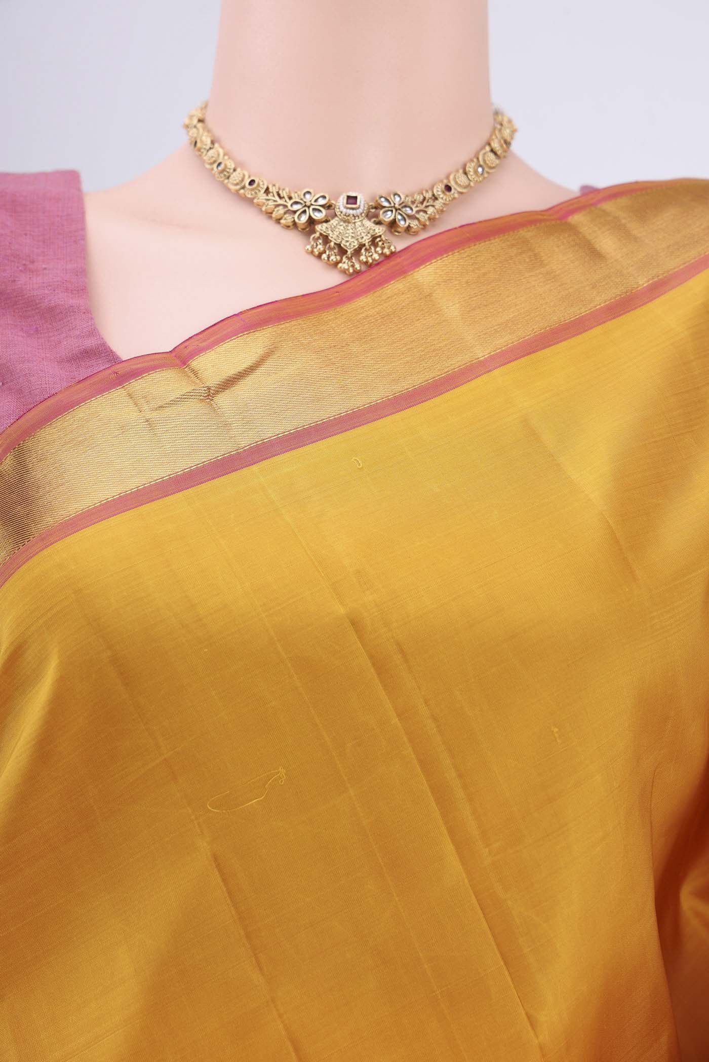 Border image of Yellow Kanjivaram Saree with Plain Body and Zari Border. 