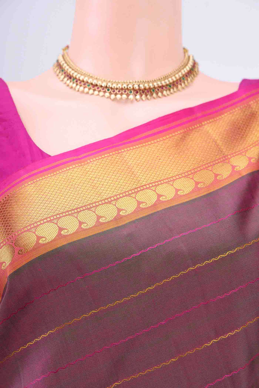 Border image of Light Magenta Kanchipuram Saree with Stripes on the body and Zari Border. 