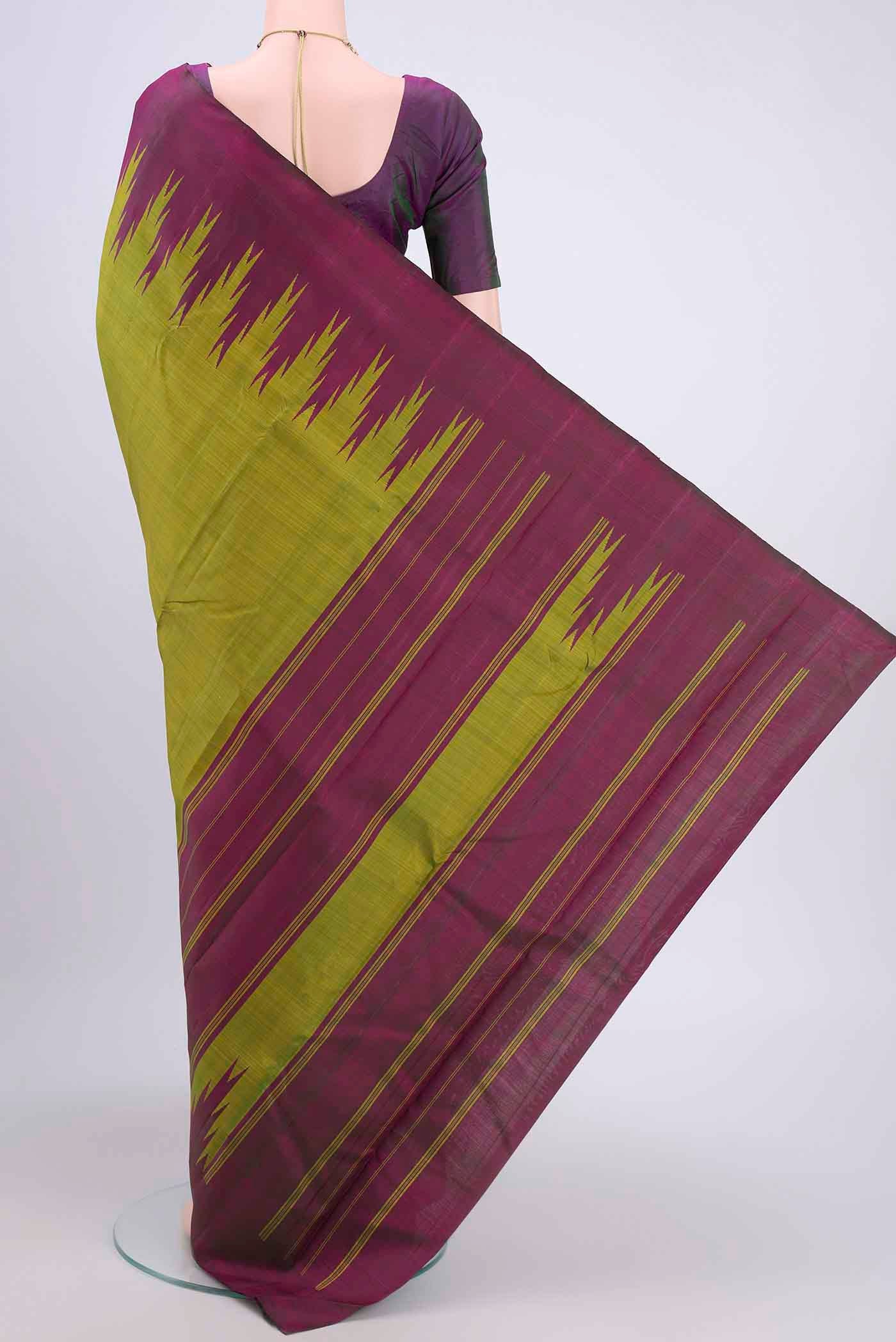 Flat view of Light Green Kanchipuram Saree with Plain Body and Temple Border