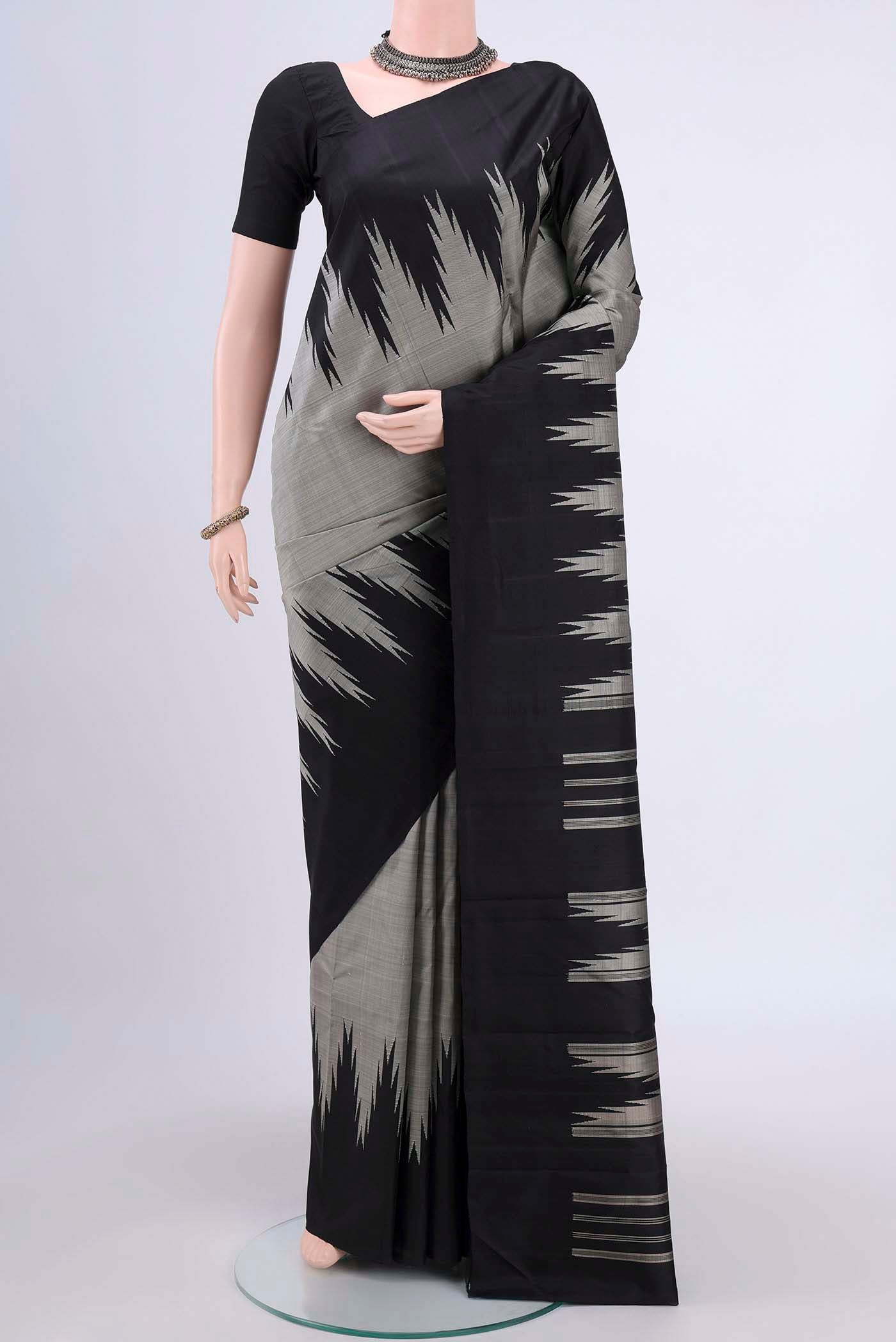 Grey Kanchipuram Saree with Plain Body and Temple Border displayed on a mannequin