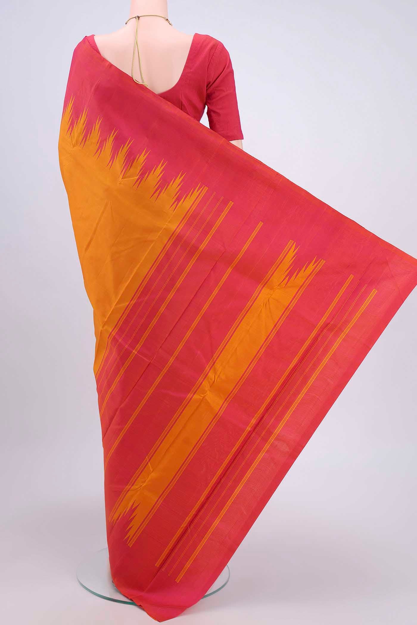 Flat view of Mustard Kanchipuram Saree with Plain Body and Temple Border. 