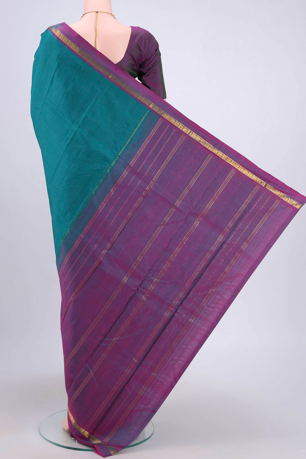 Flat view of Sea Green Kanjivaram Silk Saree with Plain Body and Zari Border. 