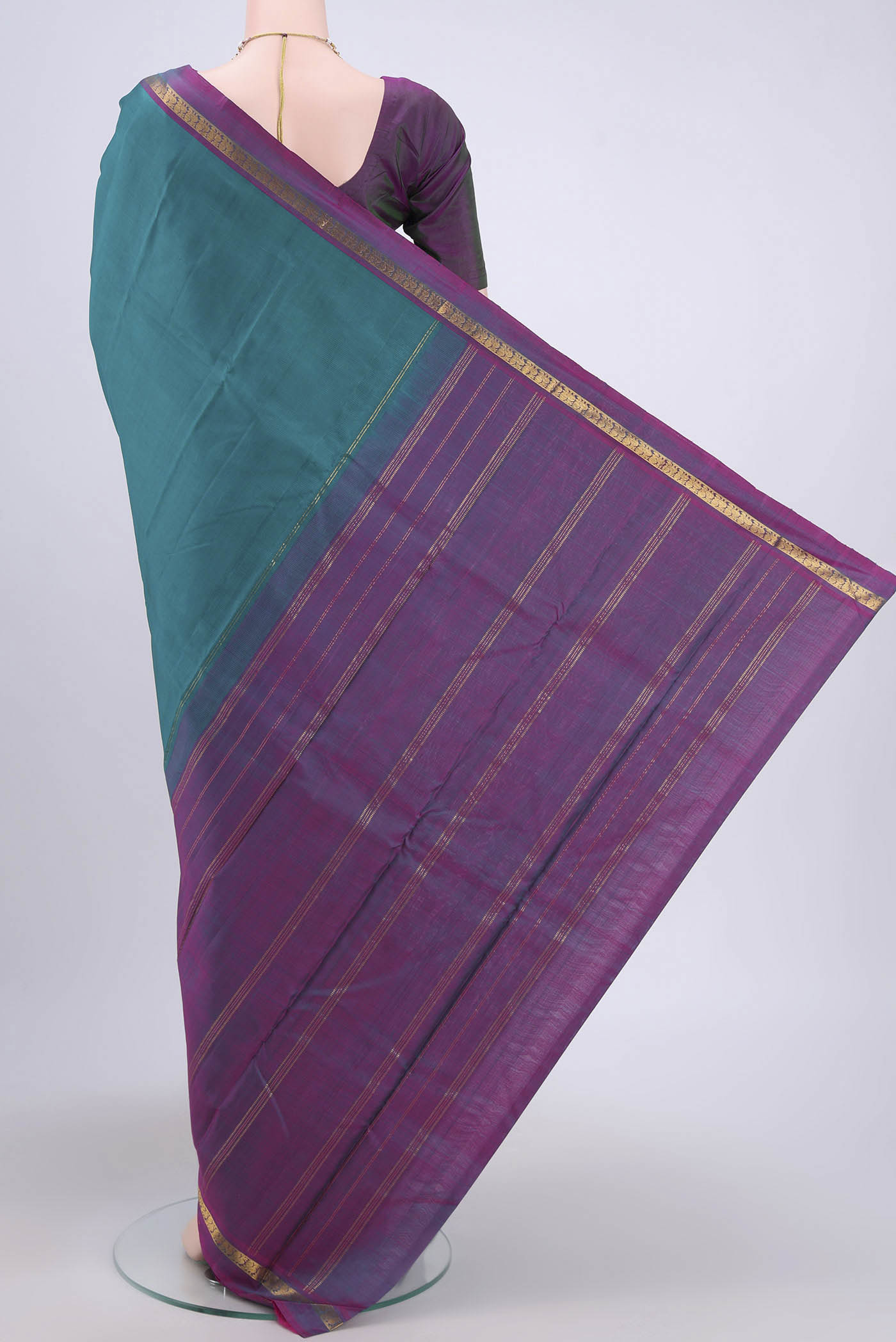 Flat view of Sea Green Kanjivaram Silk Saree with Plain Body and Zari Border. 
