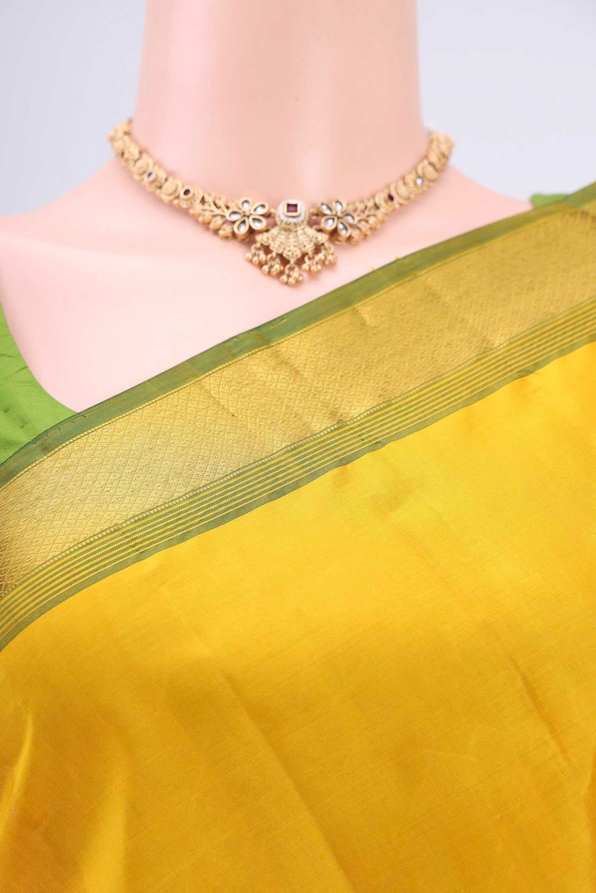 Border image of Lemon Yellow Dual Tone Kanjivaram Saree with Plain Body and Zari Border. 
