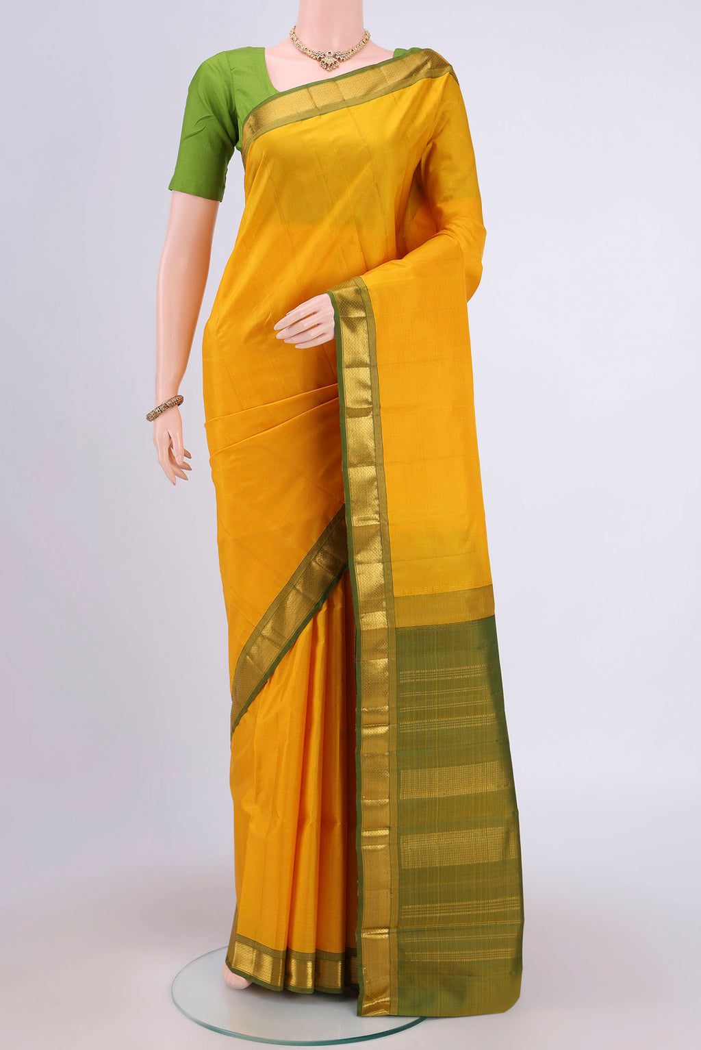 Lemon Yellow Dual Tone Kanjivaram Saree with Plain Body and Zari Border.  displayed on a mannequin
