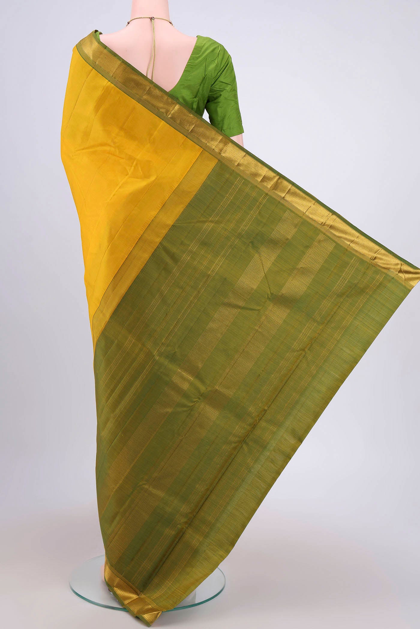 Flat view of Lemon Yellow Dual Tone Kanjivaram Saree with Plain Body and Zari Border. 