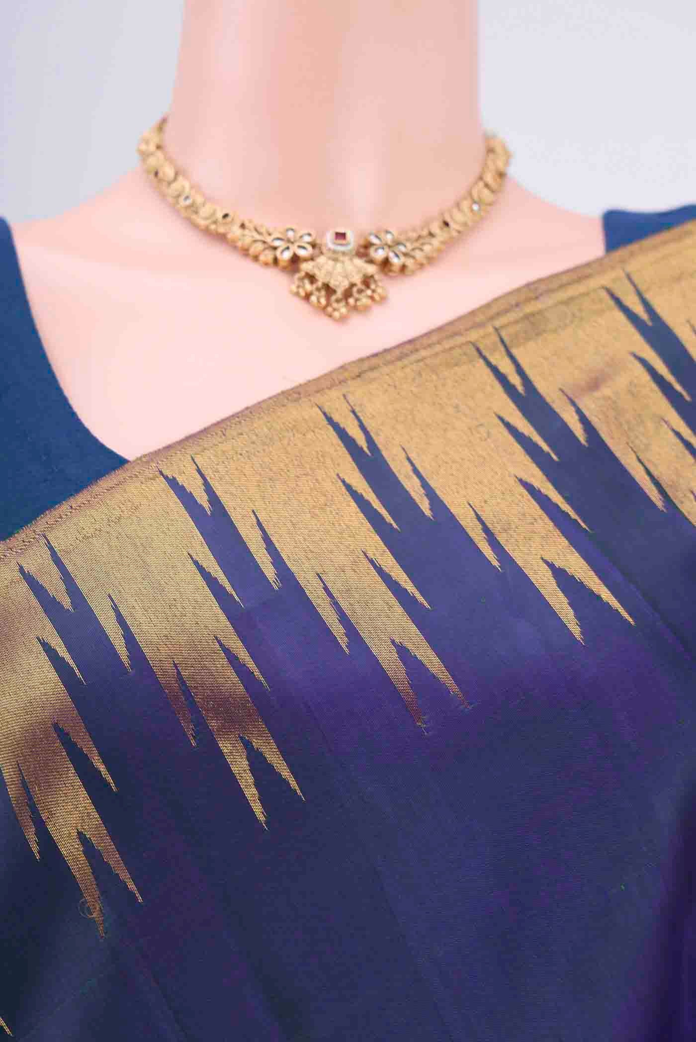 Border image of Peacock Blue Kanjivaram Saree with Plain Body and Temple Border. 