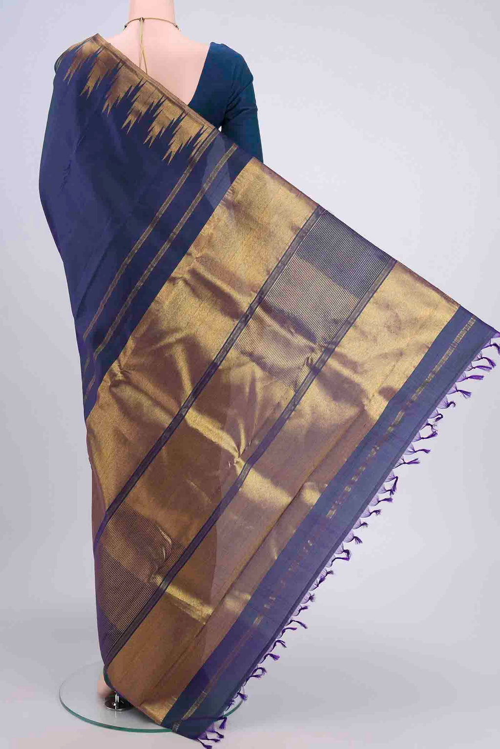 Flat view of Peacock Blue Kanjivaram Saree with Plain Body and Temple Border. 