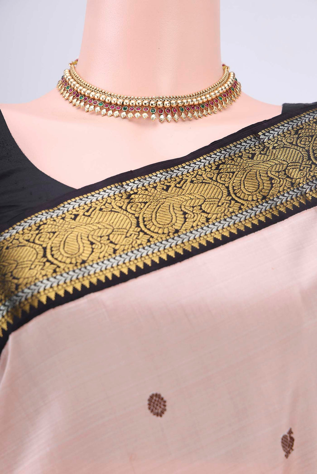 Border image of Peach Dual Tone Kanjivaram Silk Saree with Thread Butta on the body and Zari Border. 