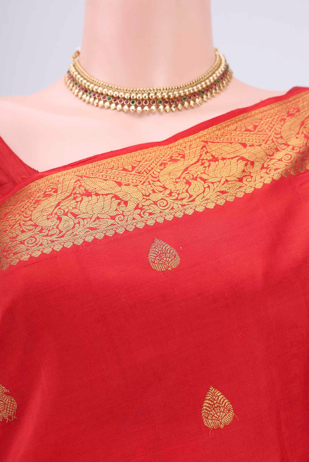 Border image of Red Kanjivaram Saree with Zari Butta on the body and Zari Border. 