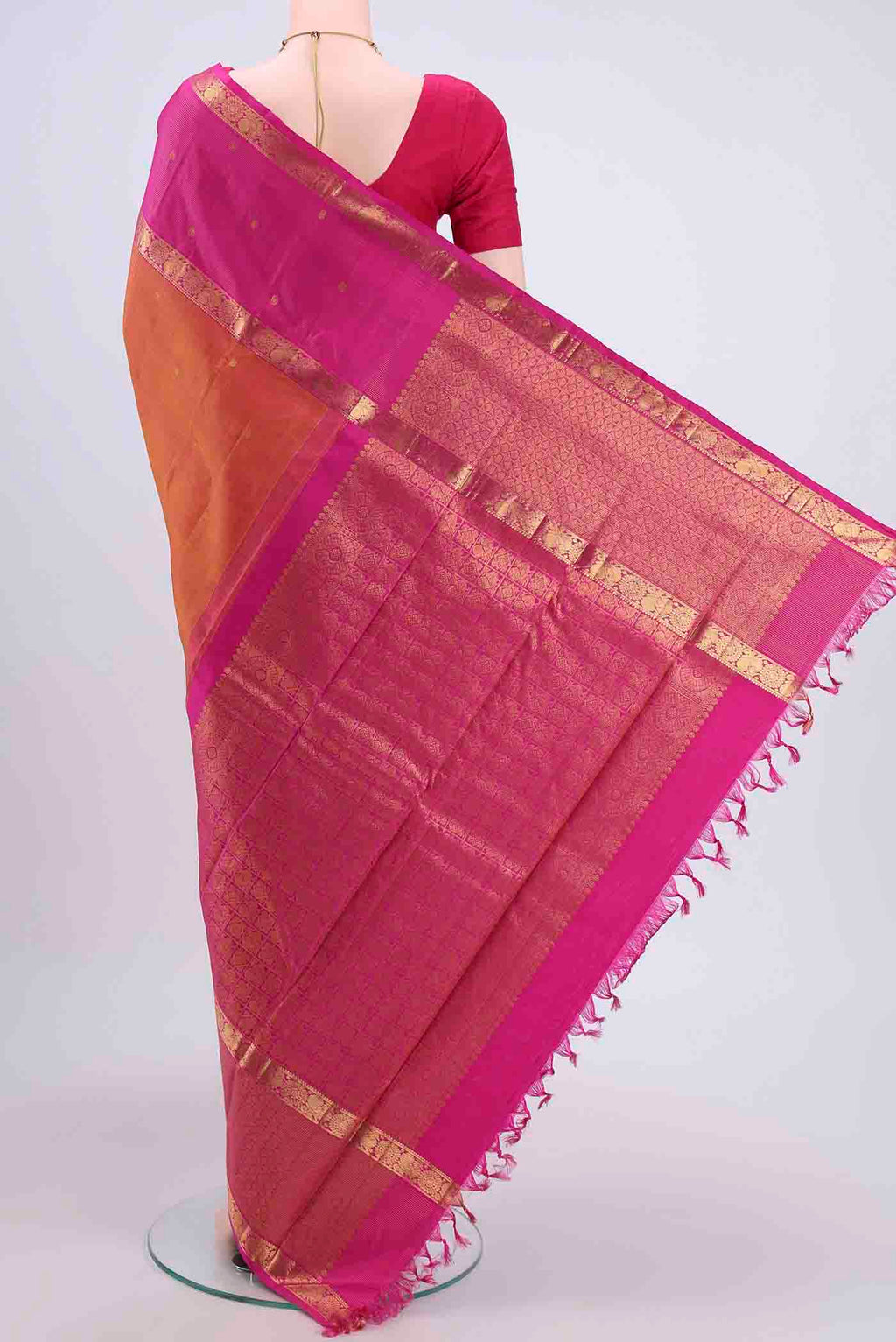 Flat view of Brick Orange Kanchipuram Saree with Zari Butta on the body and Zari Border