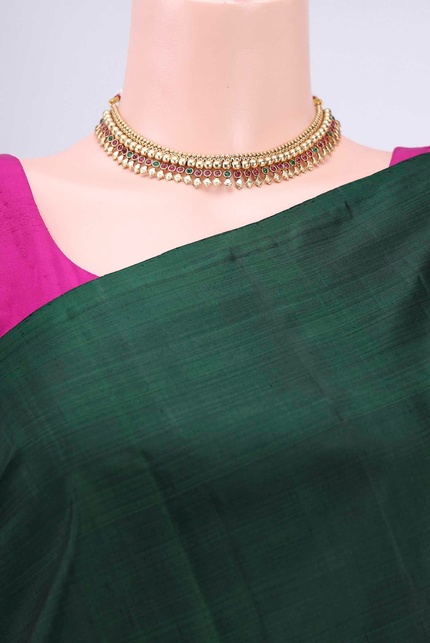 Border image of Bottle Green Kanchipuram Saree with Zari Butta on the body and Zari Border. 