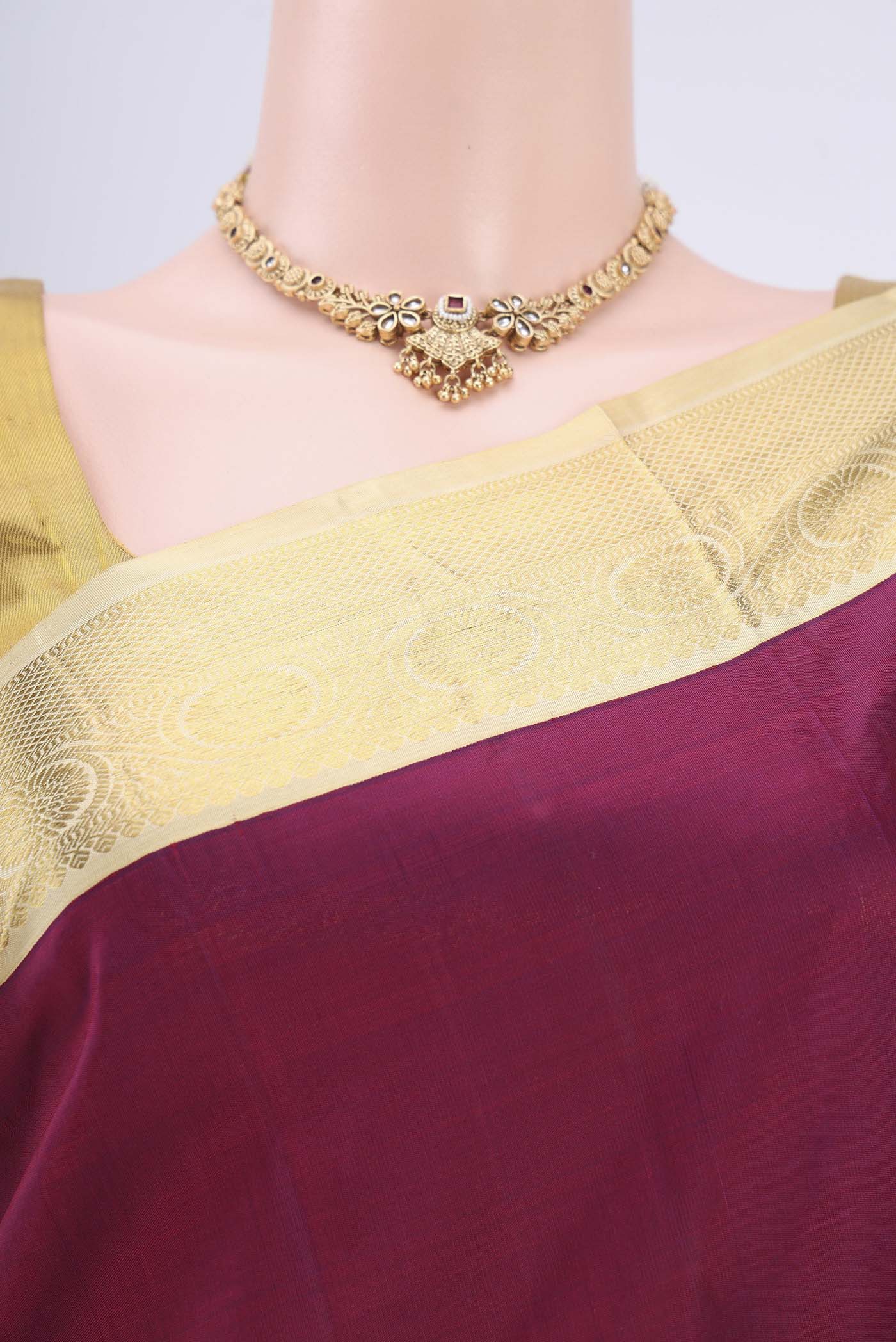 Border image of Burgundy Dual Tone Kanjivaram Saree with Plain Body and Zari Border. 