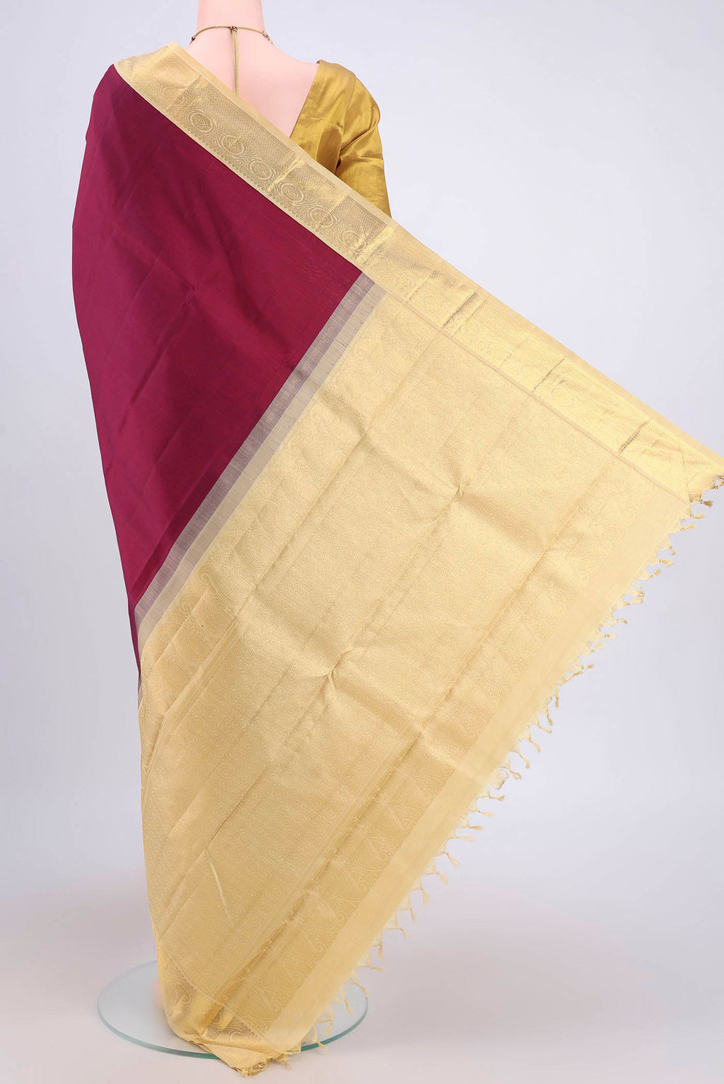Flat view of Burgundy Dual Tone Kanjivaram Saree with Plain Body and Zari Border. 