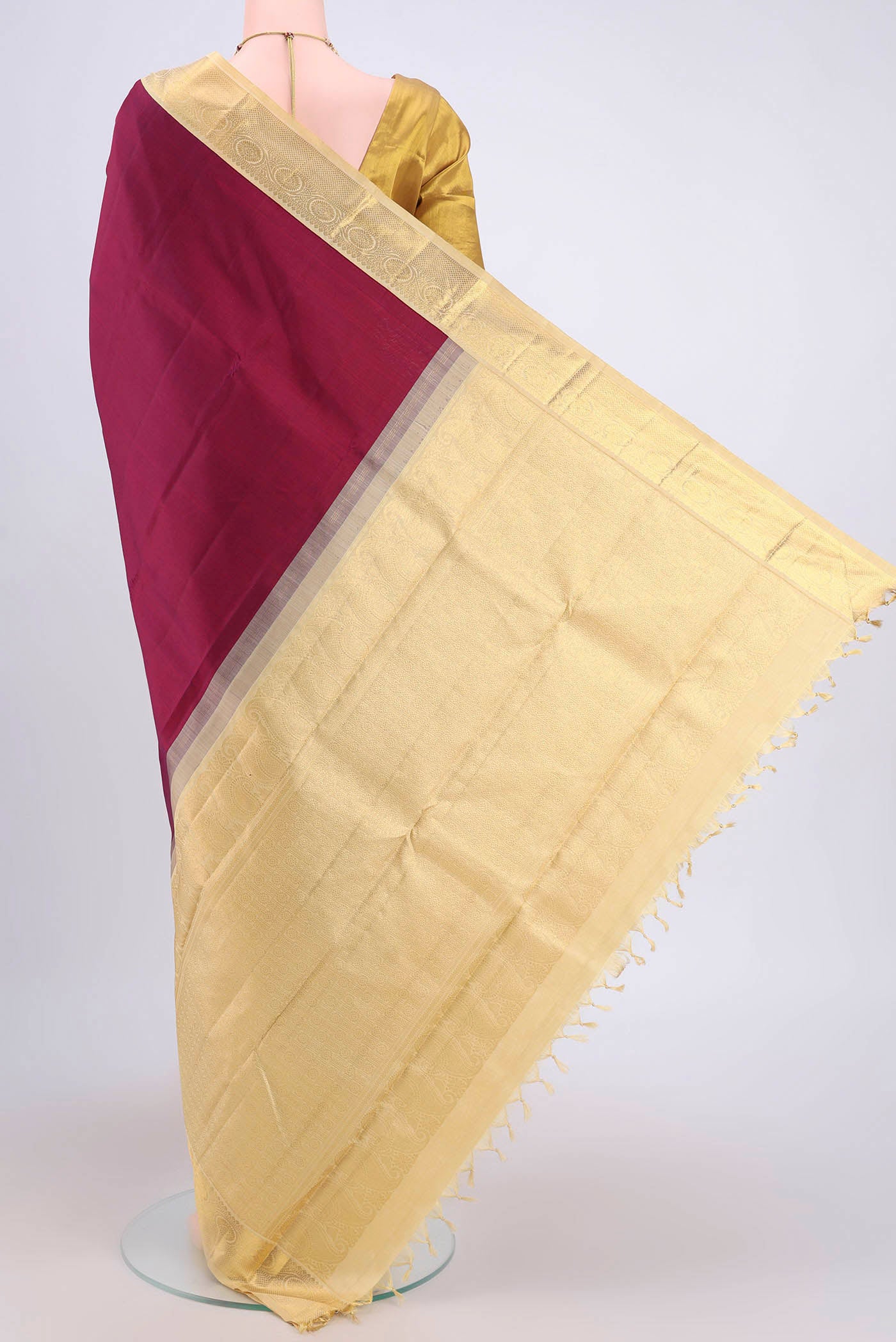 Flat view of Burgundy Dual Tone Kanjivaram Saree with Plain Body and Zari Border. 