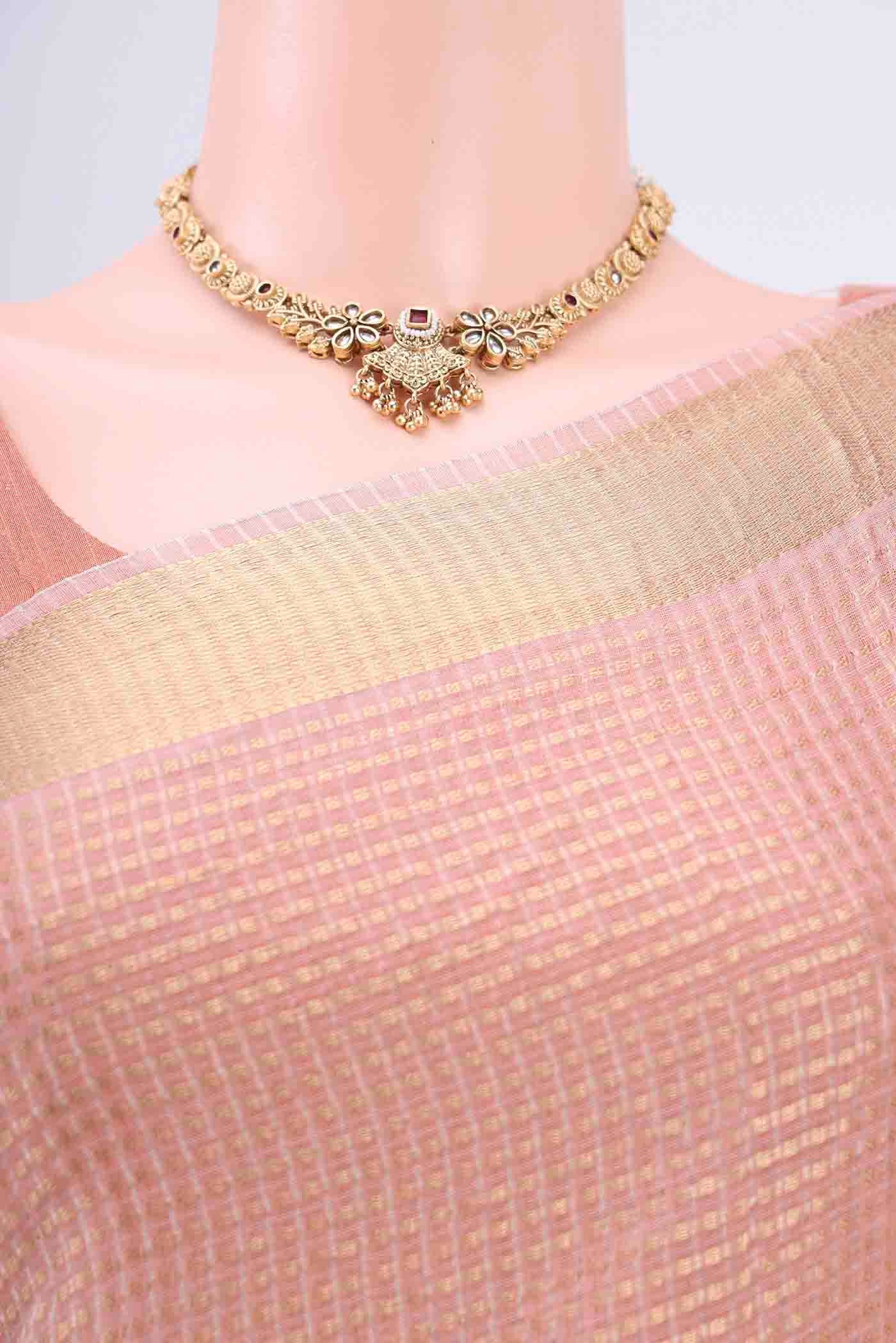 Border image of Peach Tussar Silk Saree with Checked design on the body and Plain Border. 