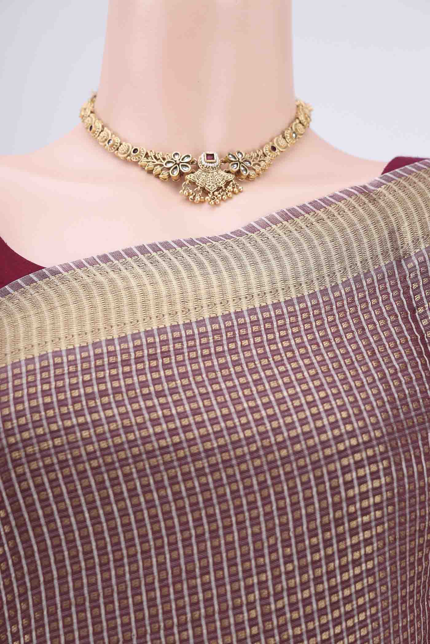 Border image of Brown MP Tussar Saree with Checked design on the body and Temple Border. 