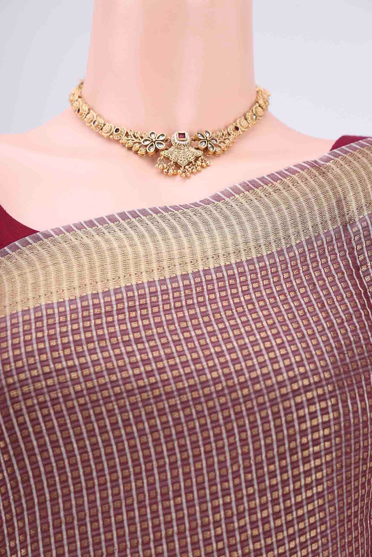Border image of Brown MP Tussar Saree with Checked design on the body and Temple Border. 