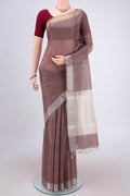 Brown MP Tussar Saree with Checked design on the body and Temple Border.  displayed on a mannequin