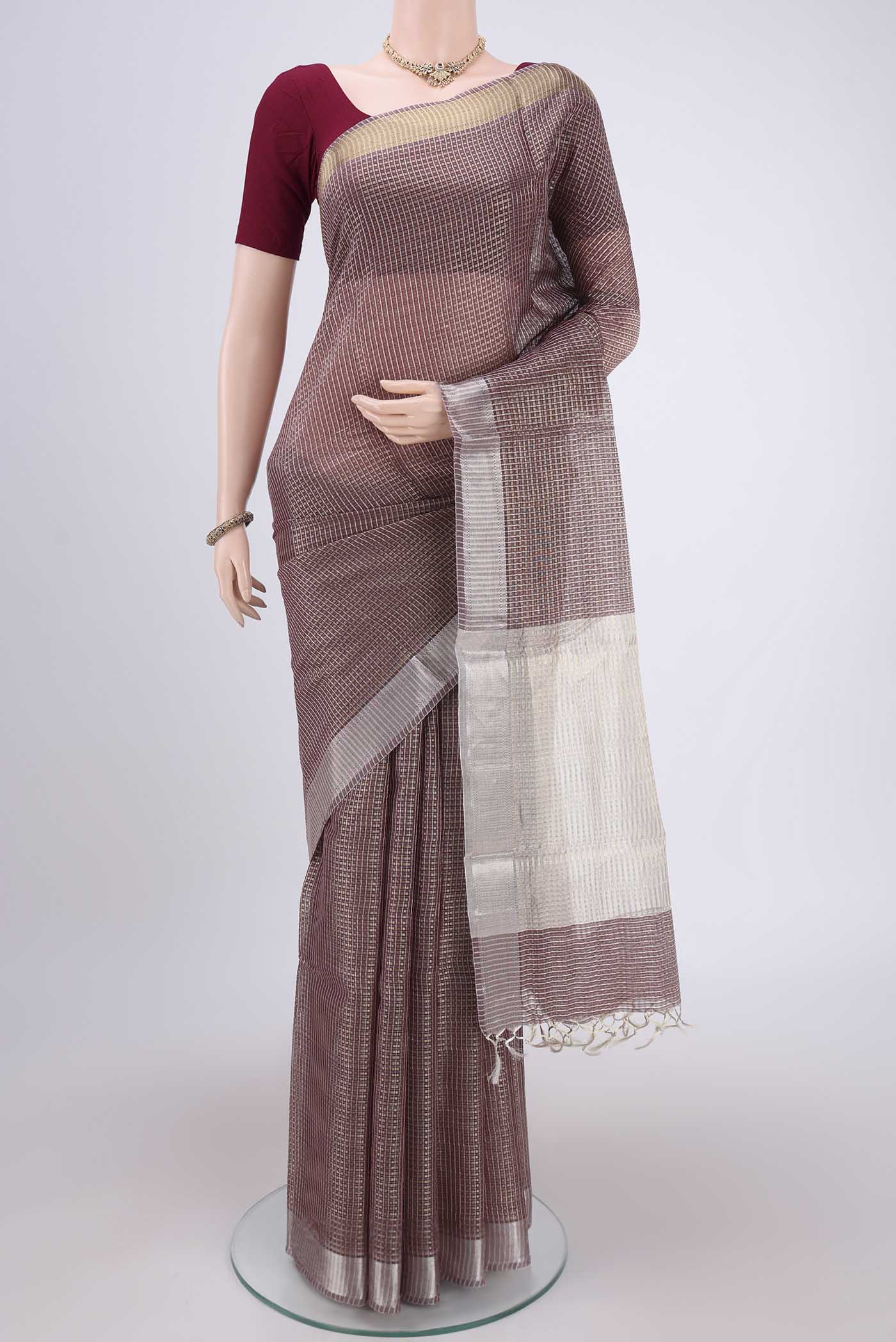 Brown MP Tussar Saree with Checked design on the body and Temple Border.  displayed on a mannequin