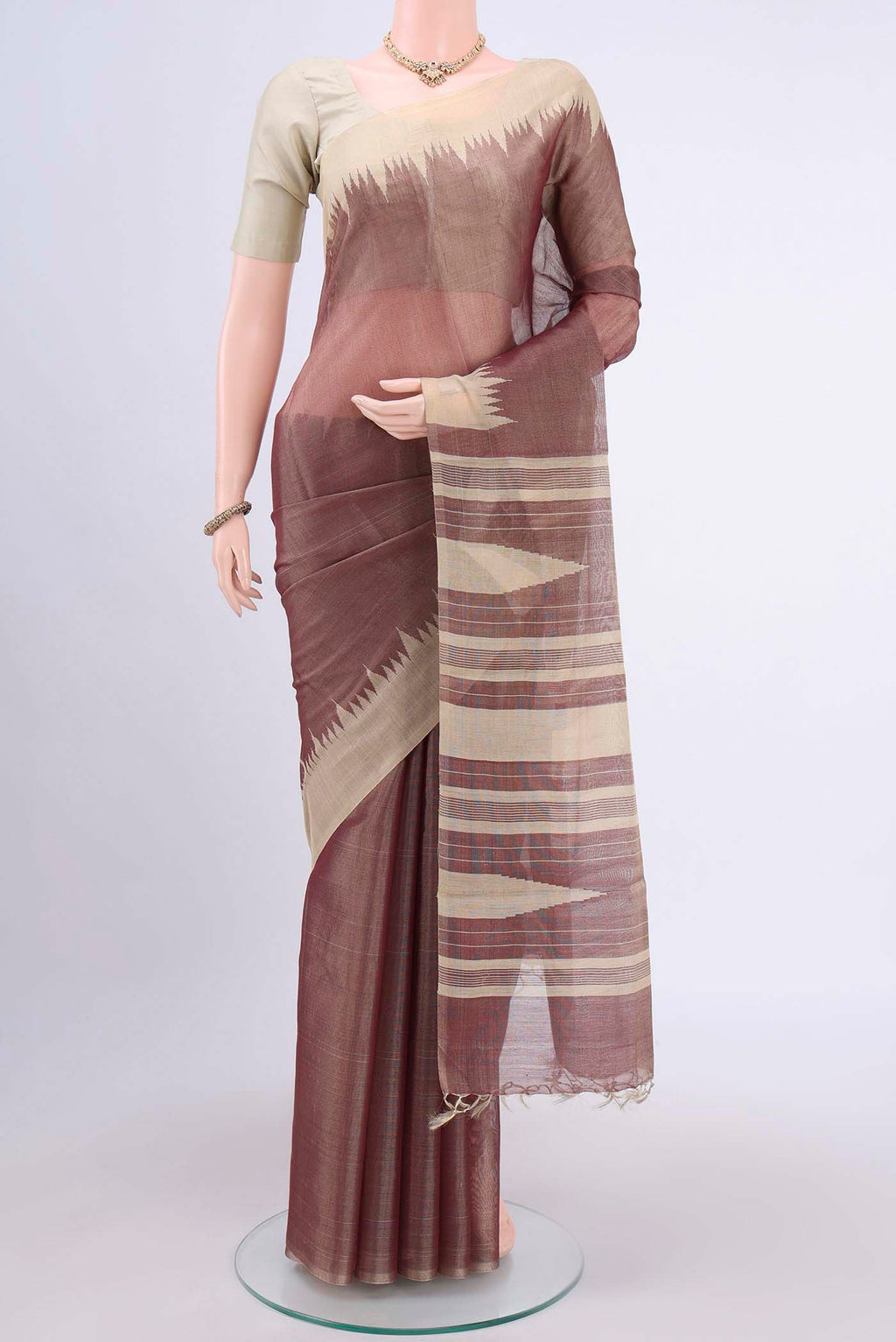 Brown Tussar Silk Saree with Plain Body and Temple Border displayed on a mannequin