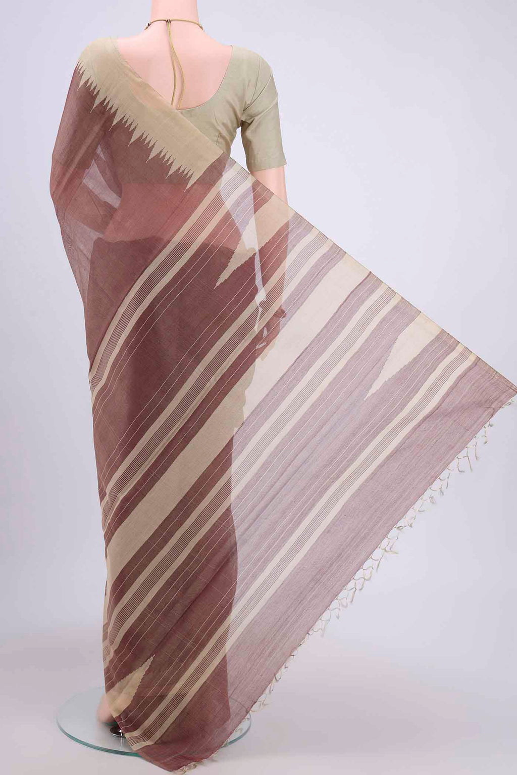 Flat view of Brown Tussar Silk Saree with Plain Body and Temple Border