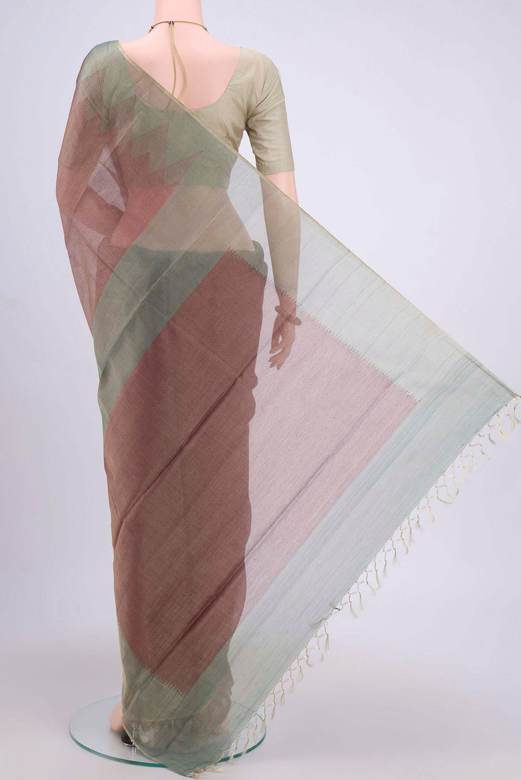Flat view of Brown Tussar Silk Saree with Plain Body and Temple Border