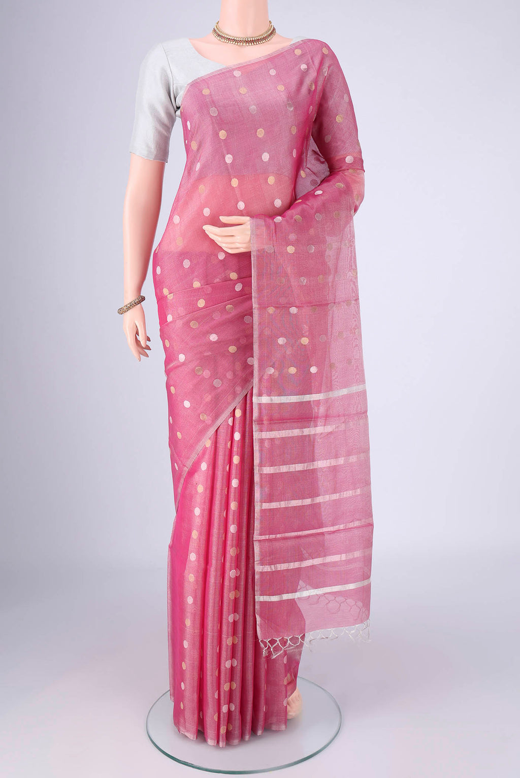 Rose pink MP Tussar Saree with Zari Butta on the body and Thin Zari Line.  displayed on a mannequin