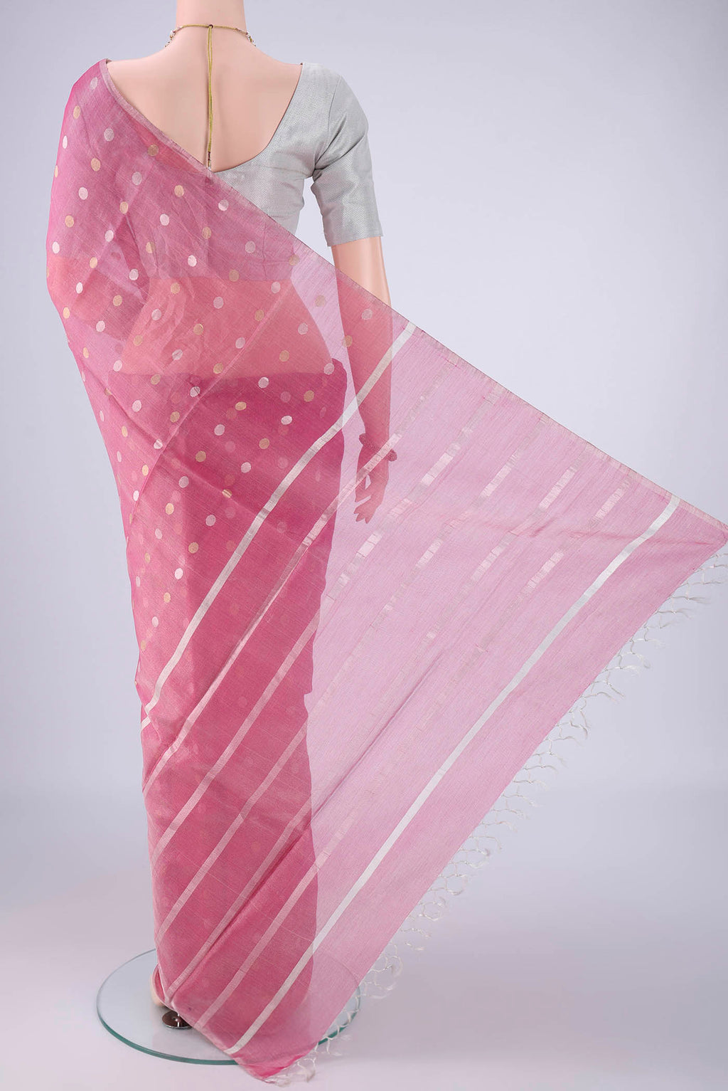 Flat view of Rose pink MP Tussar Saree with Zari Butta on the body and Thin Zari Line. 