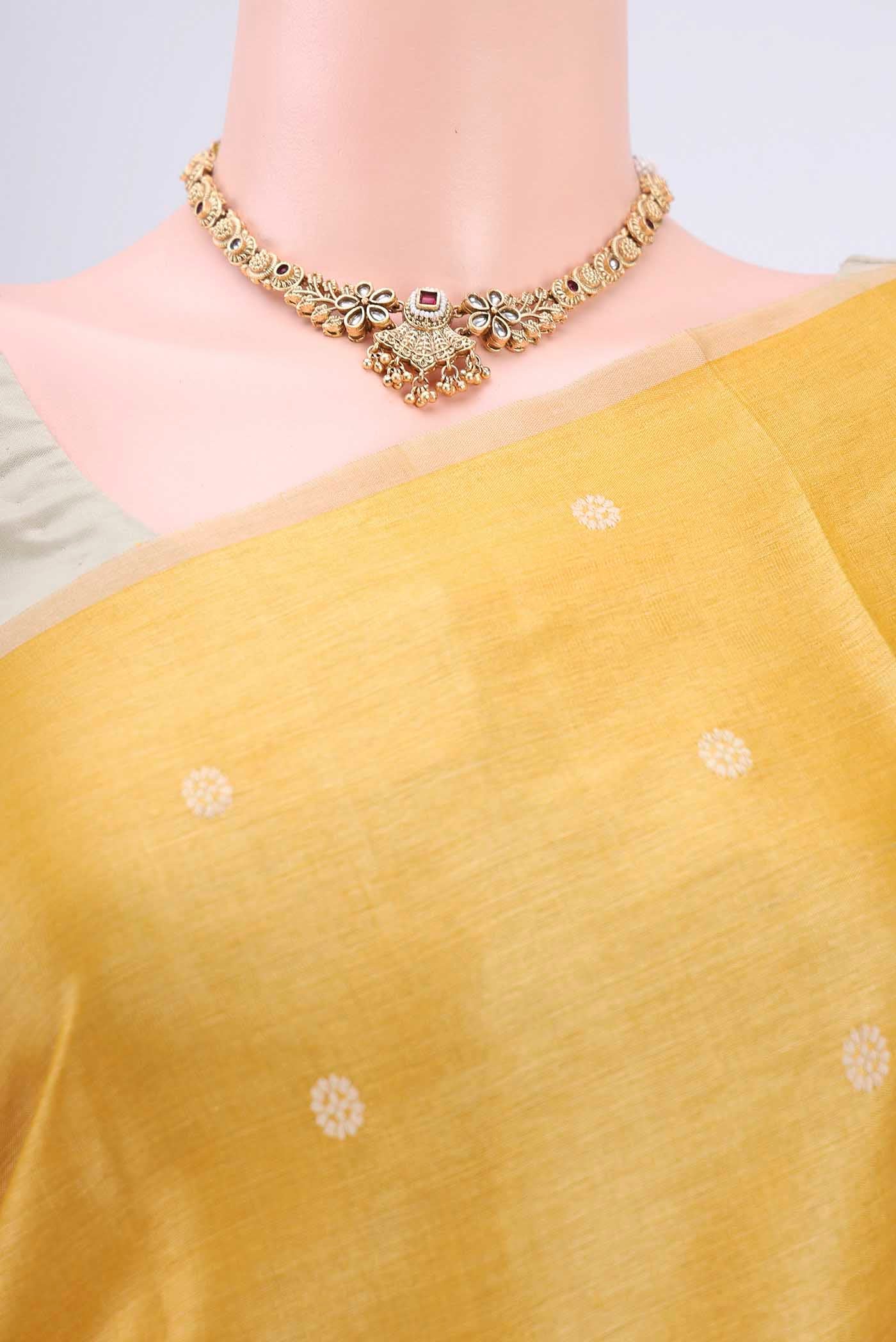 Border image of Lemon Yellow Tussar Silk Saree with Thread Butta on the body and Plain Border