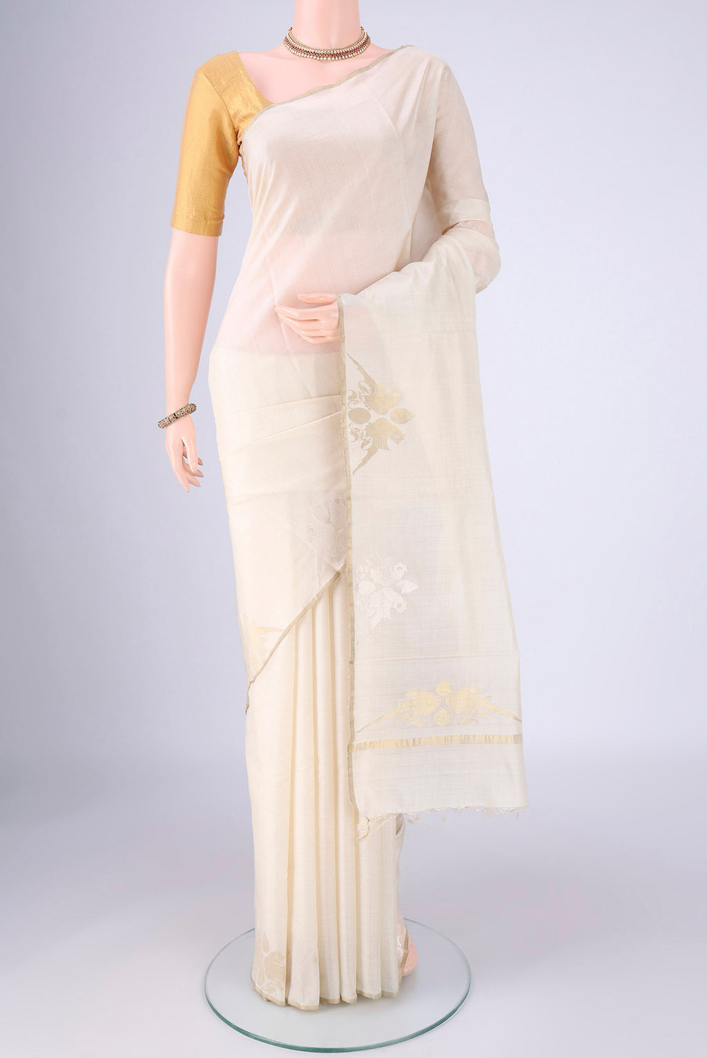 Off White MP Tussar Saree with Plain Body and Zari Border.  displayed on a mannequin