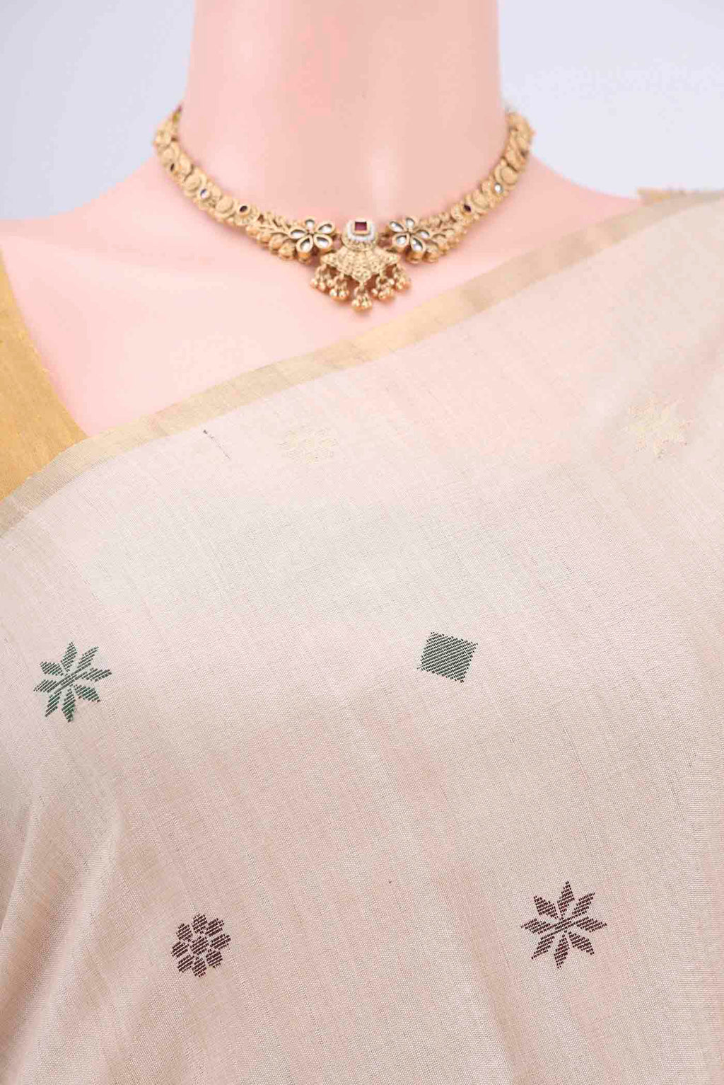 Border image of Beige Tussar Silk Saree with Zari And Thread Butta on the body and Thin Zari Line. 