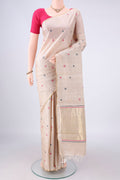 Beige MP Tussar Saree with Thread Butta on the body and Zari Border.  displayed on a mannequin