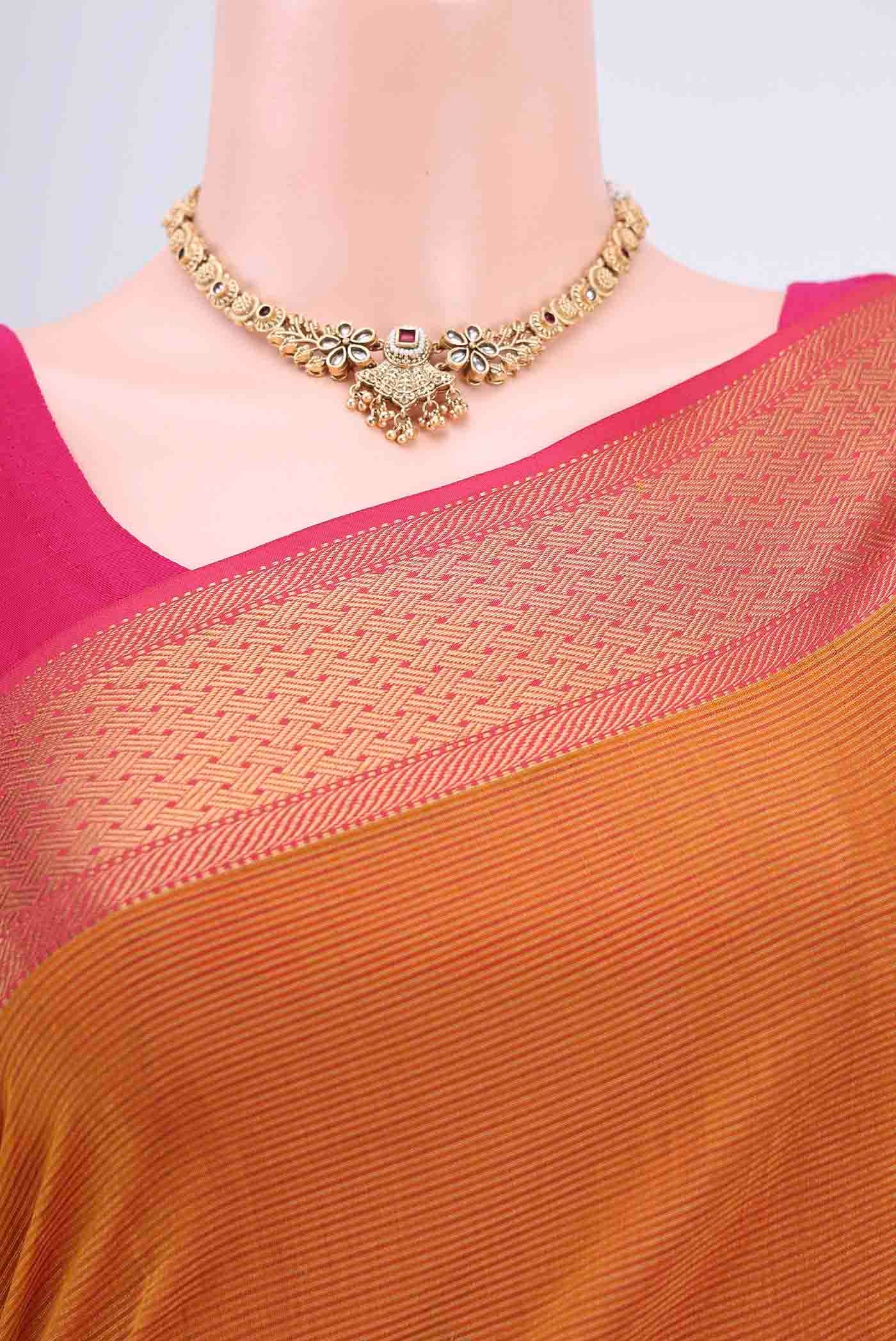 Border image of Mustard Tussar Silk Saree with Thread Butta on the body and Zari Border. 