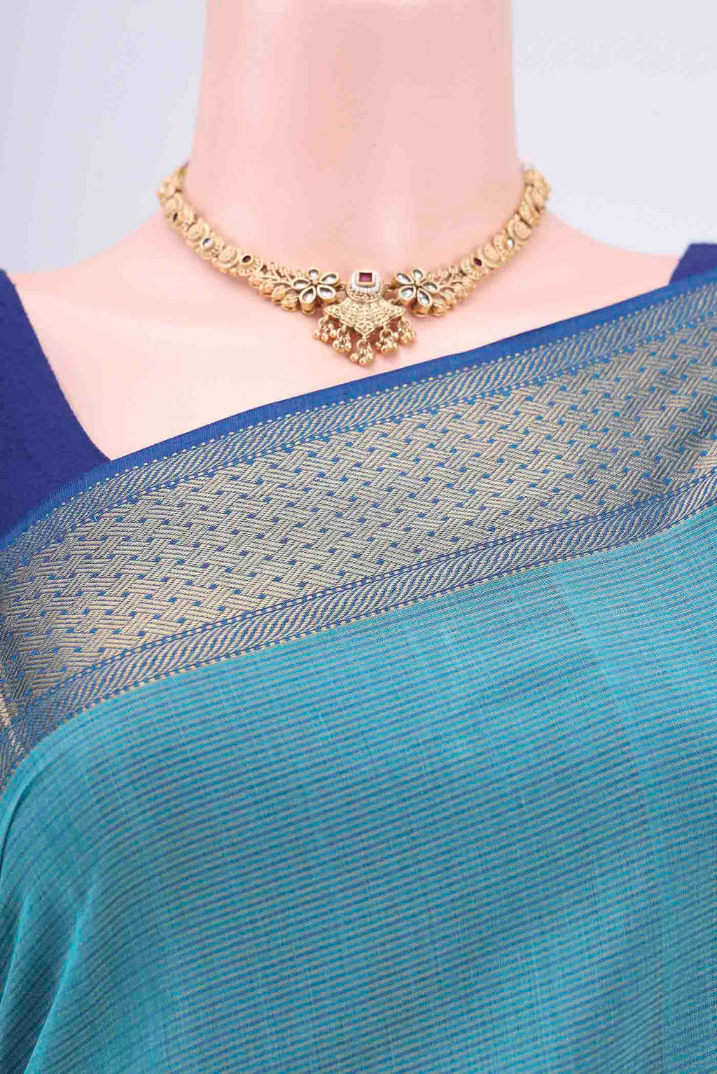 Border image of Turquoise Tussar Silk Saree with Thread Butta on the body and Zari Border. 