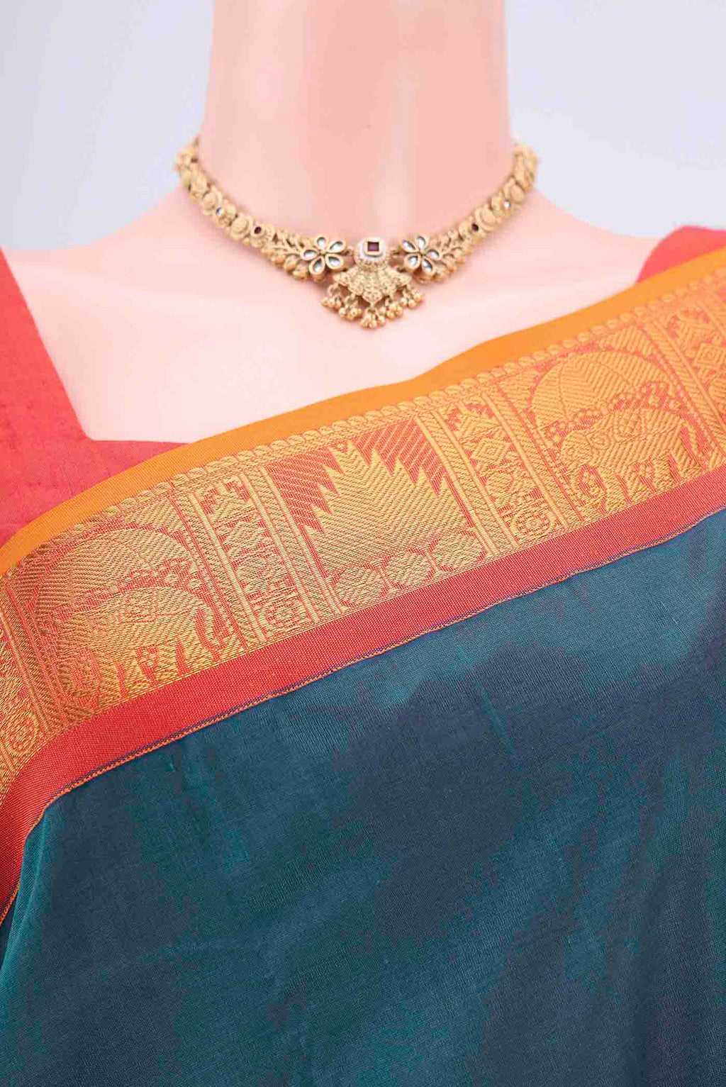 Border image of Peacock Blue Silk Cotton Saree with Plain Body and Zari Border. 