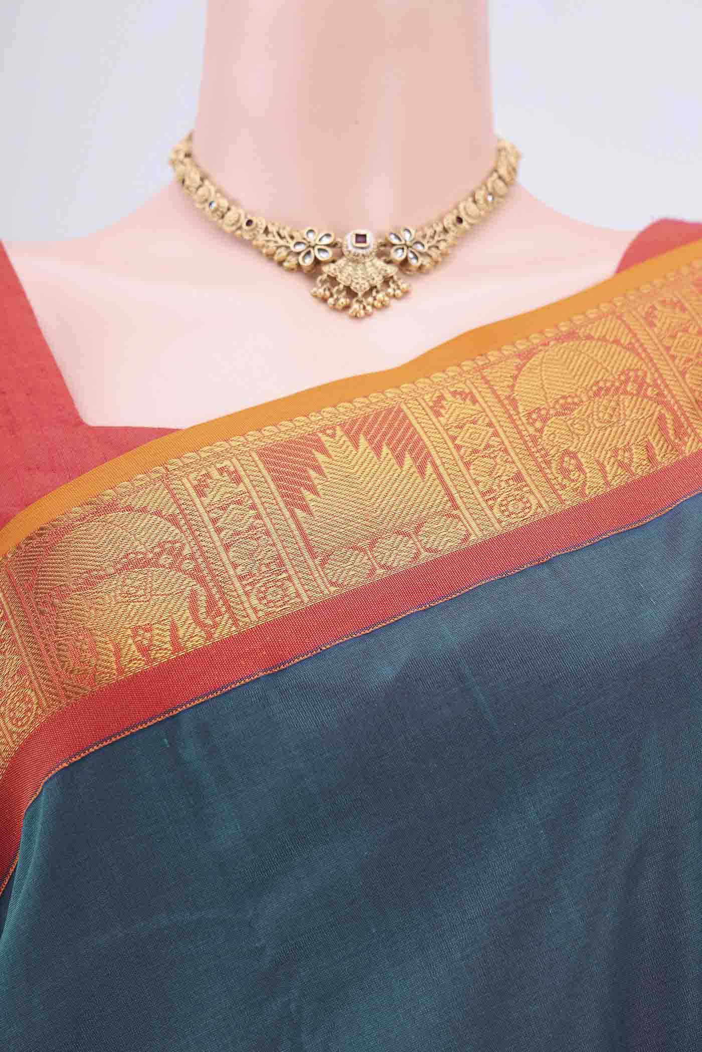 Border image of Peacock Blue Silk Cotton Saree with Plain Body and Zari Border. 