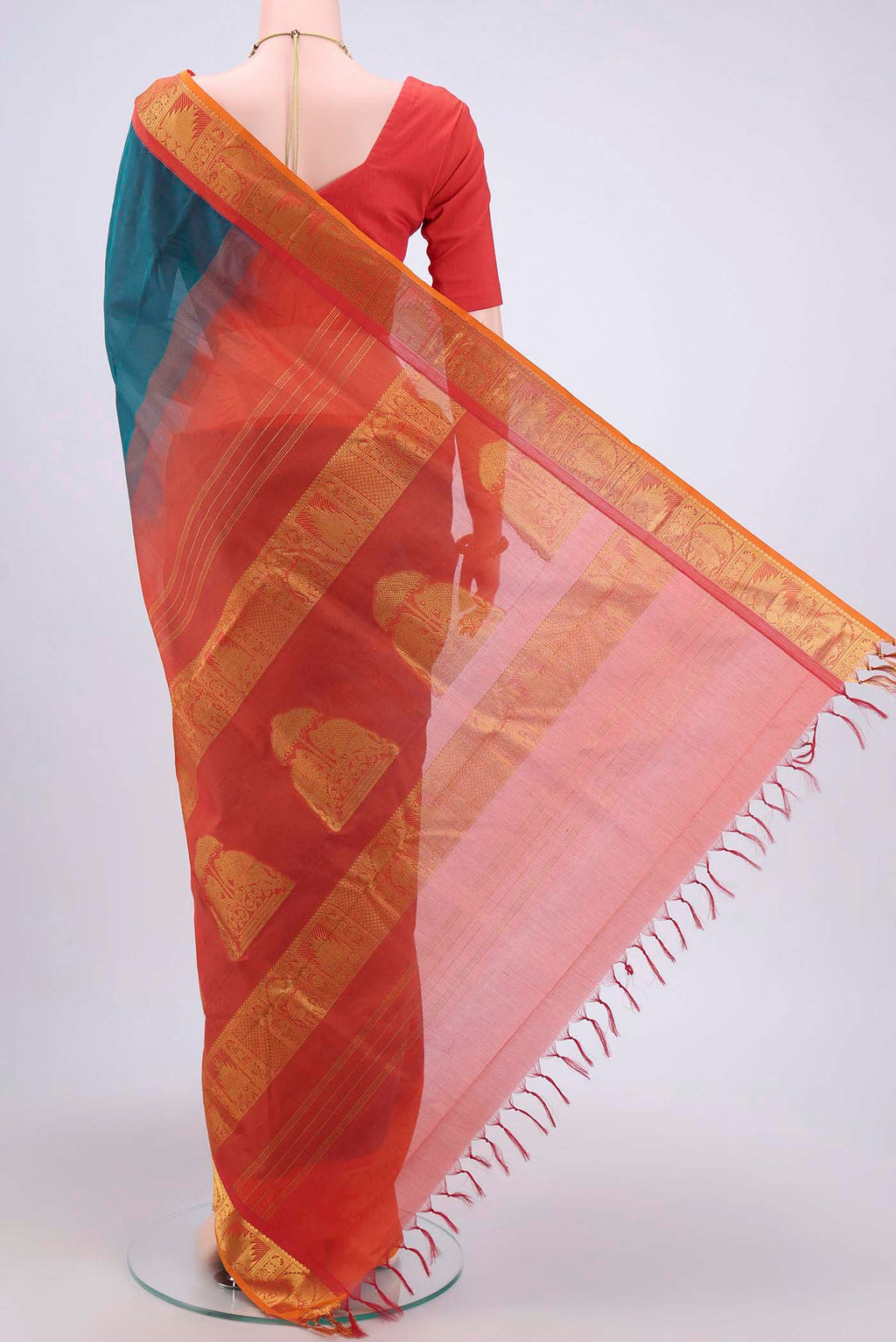 Flat view of Peacock Blue Silk Cotton Saree with Plain Body and Zari Border. 