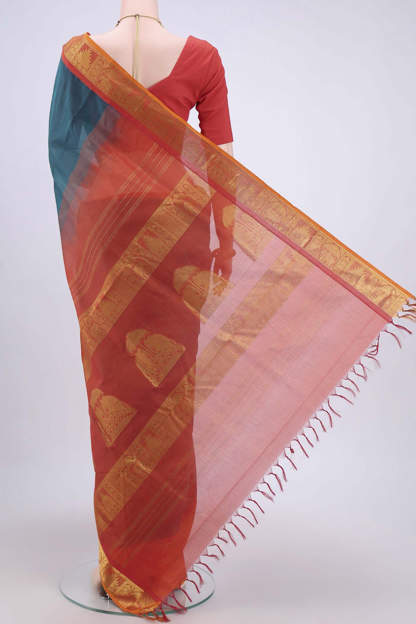 Flat view of Peacock Blue Silk Cotton Saree with Plain Body and Zari Border. 