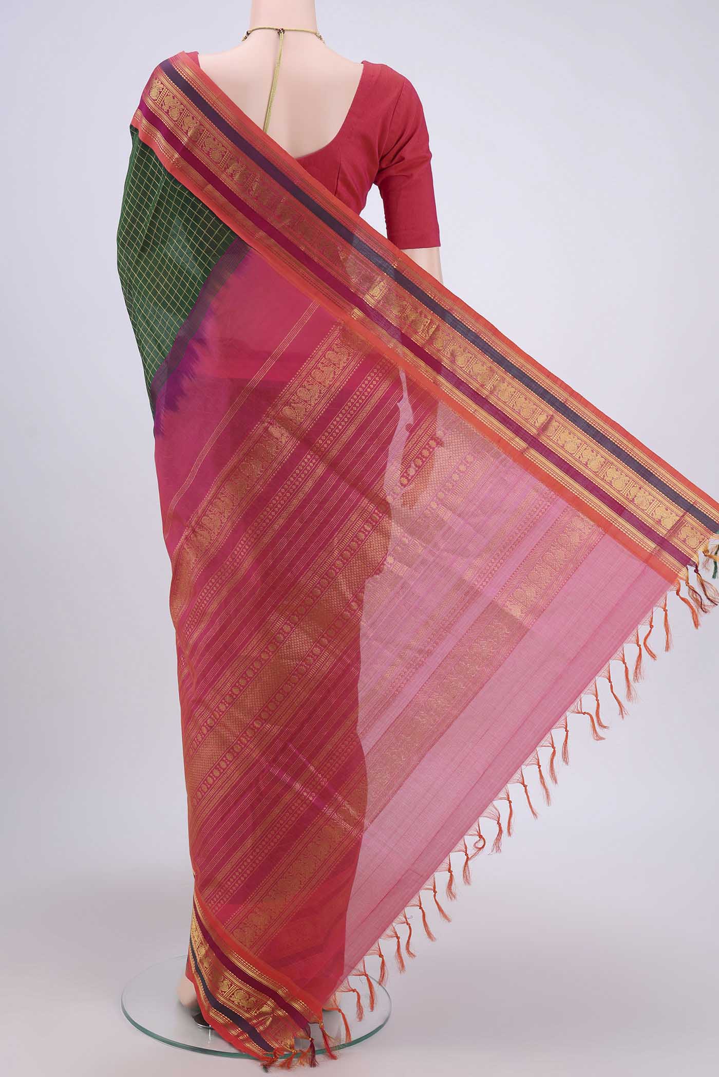 Flat view of Bottle Green Silk Cotton Saree with Checked design on the body and Zari Border. 